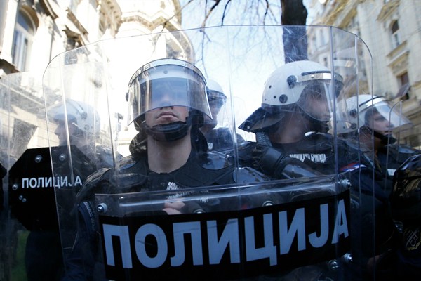 Members of the Serbian gendarmerie stand guard in front of the Serbian presidency building in Belgrade, Serbia, March 17, 2019 (AP photo by Darko Vojinovic).