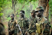 Ugandan soldiers patrol through the Central African jungle during an operation to hunt notorious Lord’s Resistance Army leader Joseph Kony, April 19, 2012 (Photo by Yannick Tylle for dpa via AP Images).