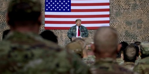 President Donald Trump addresses troops at Al Asad Airbase, Iraq, Dec. 26, 2018 (AP photo by Andrew Harnik).