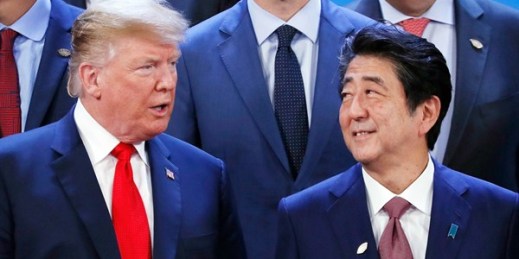 U.S. President Donald Trump and Japanese Prime Minister Shinzo Abe, along with other Group of 20 leaders, gather for a group photo in Buenos Aires, Nov. 30, 2018 (Kyodo photo via AP Images).