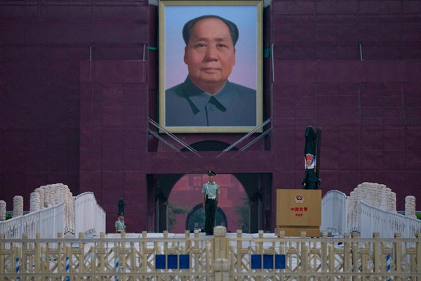 A Chinese paramilitary policeman stands guard in front of Mao Zedong’s portrait on Tiananmen Gate on the 30th anniversary of a bloody crackdown of pro-democracy protesters in Beijing, June 4, 2019 (AP photo by Ng Han Guan).