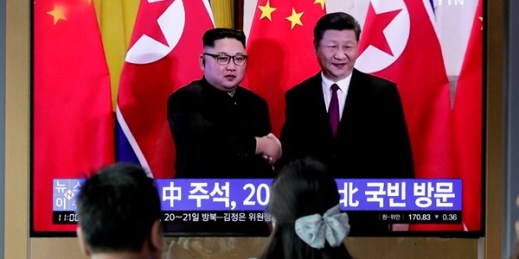 A TV news program reports on Chinese President Xi Jinping’s state visit to North Korea with file footage of Xi and North Korean leader Kim Jong Un, at the Seoul Railway Station in Seoul, South Korea, June 18, 2019 (AP photo by Lee Jin-man).