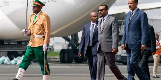 Eritrean President Isaias Afwerki, right, is welcomed by Ethiopian Prime Minister Abiy Ahmed at the airport in Addis Ababa, Ethiopia, July 14, 2018 (AP photo by Mulugeta Ayene).
