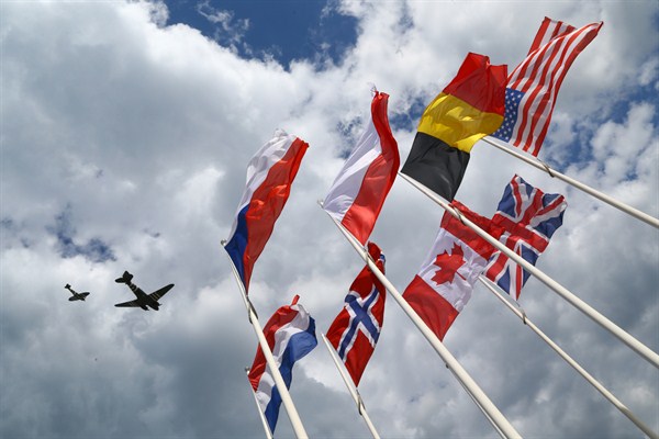 Planes from the Battle of Britain memorial flight pass over Arromanches, France, during a service to commemorate the 75th anniversary of the D-Day landings, June 6, 2019 (Press Association photo by Gareth Fuller via AP Images).