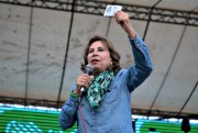 Former First Lady Sandra Torres, who is running for president with the National Unity of Hope party, UNE, shows her candidate ID to supporters during a campaign rally, Mixco, Guatemala, May 25, 2019 (AP photo by Moises Castillo).