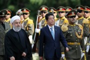 Japanese Prime Minister Shinzo Abe, center, reviews an honor guard as he is welcomed by Iranian President Hassan Rouhani, left, in an official arrival ceremony at the Saadabad Palace in Tehran, Iran, June 12, 2019 (AP photo by Ebrahim Noroozi).
