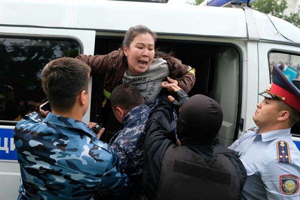 Kazakh police detain a demonstrator during protests in Almaty, Kazakhstan, June 12, 2019 (AP photo by Vladimir Tretyakov).