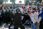 Security forces charge at protesting teachers during a demonstration in Rabat, Morocco, Feb. 20, 2019 (AP photo by Mosa’ab Elshamy).