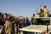 Gen. Mohammed Hamdan Daqlou, top right, the deputy head of Sudan’s Transitional Military Council, waves to supporters during a rally in the town of Garawee, northern Sudan, June 15, 2019 (AP photo).