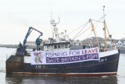 A fishing boat displays a pro-Brexit banner, near Newcastle, United Kingdom, April 8, 2018 (Photo by Owen Humphreys for Press Association via AP Images).