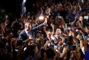 Kyriakos Mitsotakis, the leader of the New Democracy party, waves to his supporters outside party headquarters after winning parliamentary elections, Athens, July 7, 2019 (AP photo by Thanassis Stavrakis).
