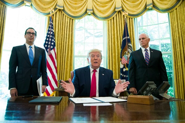 U.S. President Donald Trump, with Treasury Secretary Steven Mnuchin and Vice President Mike Pence, after signing an executive order to increase sanctions on Iran, at the White House, Washington, June 24, 2019 (AP photo by Alex Brandon).