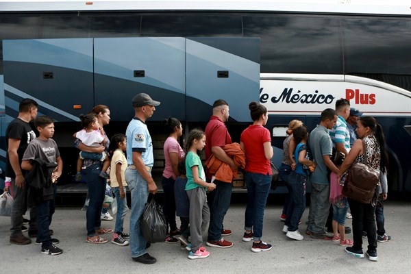 Rather than wait out their asylum application process, Central American asylum-seekers board a bus to return home, Ciudad Juarez, Mexico, July 2, 2019 (AP photo by Christian Chavez).