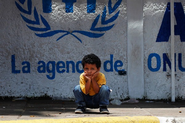 A child migrant from Central America waits outside the U.N.’s office that is dedicated to supporting refugees, in Tapachula, Mexico, June 3, 2019 (AP photo by Marco Ugarte).