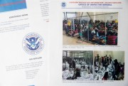 A portion of a report from government auditors reveals images of people penned into overcrowded Border Patrol facilities, photographed July 2, 2019, in Washington (AP photo by Andrew Harnik).