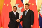 Cambodian Prime Minister Hun Sen, left, shakes hands with Chinese President Xi Jinping before their meeting at the Great Hall of the People, in Beijing, April 29, 2019 (pool photo by Madoka Ikegami of Kyodo via AP Images).