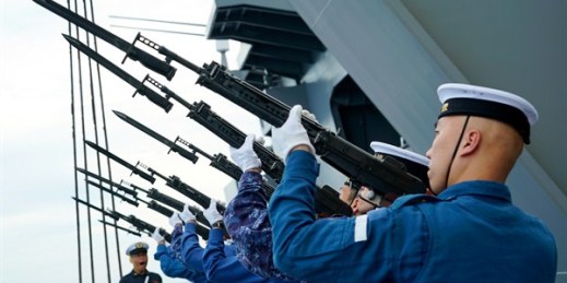Members of Japan’s Maritime Self-Defense Force aim their rifles towards the sky during a rehearsal ahead of a memorial ceremony commemorating those who died during World War II, as they sail past the Sulu Sea, June 28, 2019 (AP photo by Emily Wang).