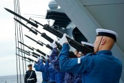 Members of Japan’s Maritime Self-Defense Force aim their rifles towards the sky during a rehearsal ahead of a memorial ceremony commemorating those who died during World War II, as they sail past the Sulu Sea, June 28, 2019 (AP photo by Emily Wang).