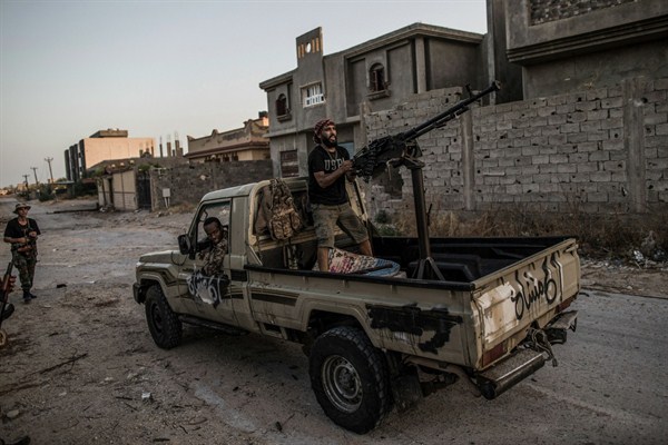 Fighters from Libya’s U.N.-backed Government of National Accord clash with forces of the self-styled Libyan National Army at the Salah al-Din frontline, Tripoli, Libya, July 29, 2019 (Photo by Amru Salahuddien for dpa via AP Images).