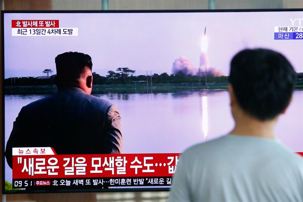 A man watches a TV showing an image of a North Korean missile launch during a news program at the Seoul Railway Station in Seoul, South Korea, Aug. 6, 2019 (AP photo by Ahn Young-joon).