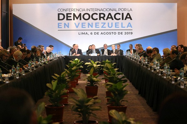 Peruvian Foreign Minister Nestor Popolizio, center, speaks at a conference of more than 50 nations that largely support Venezuelan opposition leader Juan Guaido, in Lima, Peru, Aug. 6, 2019 (AP photo by Martin Mejia).