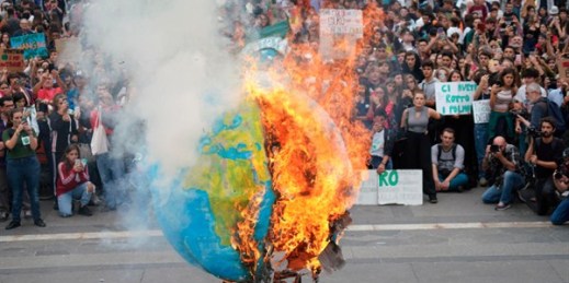 A replica of planet Earth set ablaze during a worldwide protest demanding action on climate change, in Milan, Italy, Sept. 27, 2019 (ANSA photo by Nicola Marfisi via AP images).