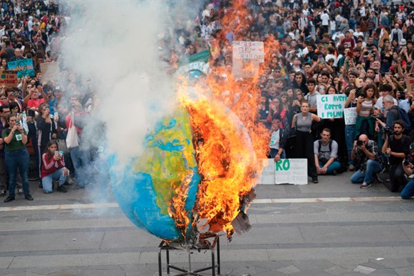 A replica of planet Earth set ablaze during a worldwide protest demanding action on climate change, in Milan, Italy, Sept. 27, 2019 (ANSA photo by Nicola Marfisi via AP images).