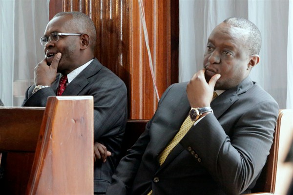 Kenyan Finance Minister Henry Rotich, right, and his principal secretary, Kamau Thugge, at a court hearing in Nairobi, Kenya, July 23, 2019 (AP photo by Khalil Senosi).