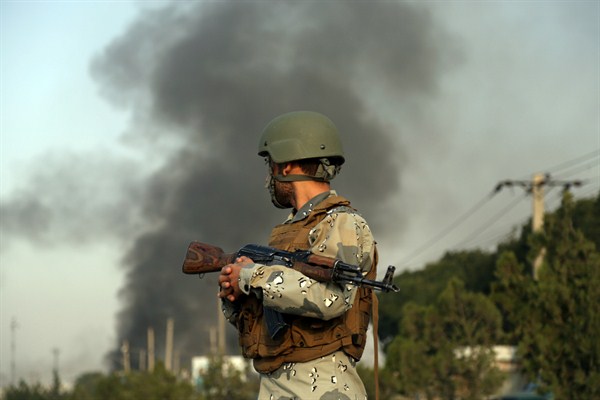 Smoke rises as angry residents set fire to part of the Green Village compound in Kabul, Afghanistan, Sept. 3, 2019 (AP photo by Rahmat Gul).