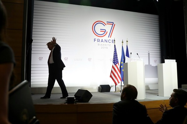 President Donald Trump walks off after a joint press conference with French President Emmanuel Macron at the G-7 summit in Biarritz, France, Aug. 26, 2019 (AP photo by Andrew Harnik).