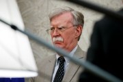 Former National Security Adviser John Bolton listens as President Donald Trump speaks during a meeting with Romanian President Klaus Iohannis in the Oval Office of the White House, Washington, Aug. 20, 2019 (AP photo by Alex Brandon).