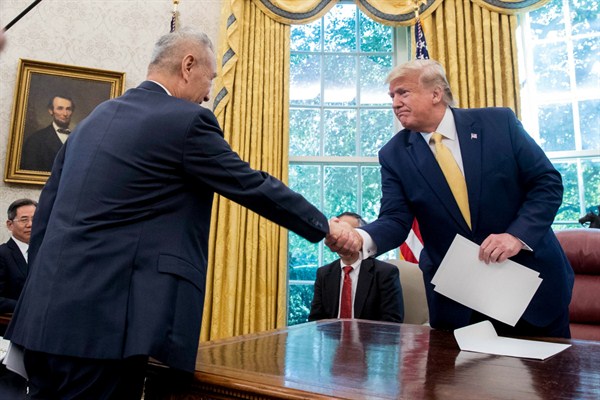 U.S. President Donald Trump and Chinese Vice Premier Liu He in the Oval Office of the White House, Washington, Oct. 11, 2019 (AP photo by Andrew Harnik).