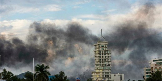 Clouds of smoke from burning cars mar the skyline of Culiacan, Mexico, Oct. 17, 2019 (AP photo by Hector Parra).
