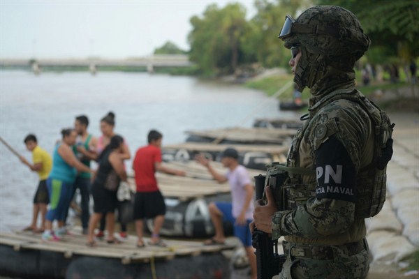 A Mexican marine stands guard at the Suchiate River border crossing between Guatemala and Ciudad Hidalgo, Mexico, June 16, 2019 (AP photo by Idalia Rie).