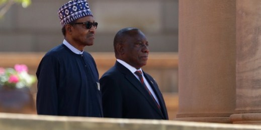 Nigerian President Muhammadu Buhari, left, stands with South African President Cyril Ramaphosa at a welcoming ceremony in Pretoria, South Africa, Oct. 3, 2019 (AP photo by Themba Hadebe).