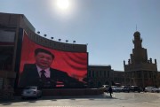 Chinese President Xi Jinping seen on a video wall in the western Chinese city of Kashgar, Nov. 8, 2018 (Photo by Simina Mistrenau for dpa via AP Images).