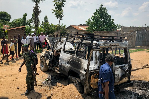Congolese security forces attend to the scene after the vehicle of an Ebola response team was attacked and burned in Beni, northeastern Congo, June 24, 2019 (AP photo by Al-hadji Kudra Maliro).