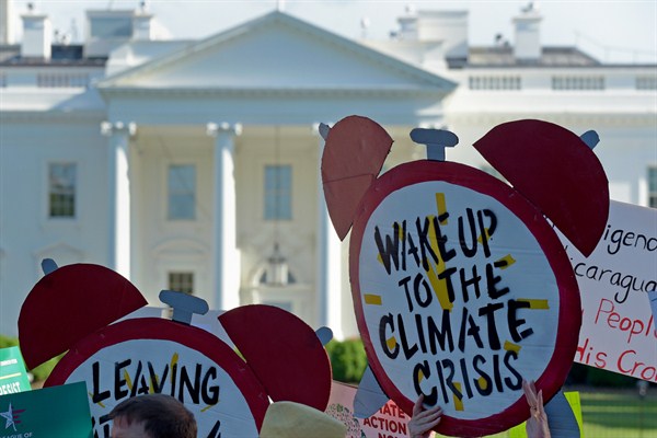 A protest outside the White House against President Donald Trump's decision to withdraw the U.S. from the Paris climate agreement, Washington, June 1, 2017 (AP photo by Susan Walsh).