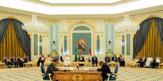 Yemeni Southern Transitional Council member Nasser al-Khabji, left, and Yemen's deputy prime minister, Salem al-Khanbashi, sign a power-sharing deal in Riyadh, Nov. 5, 2019 (Saudi Royal Palace photo by Bandar Aljaloud via AP).