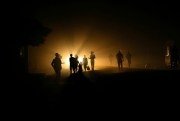 People walk home in the dark due to power shortages in Harare, Zimbabwe, Sept. 30, 2019 (AP photo by Tsvangirayi Mukwazhi).