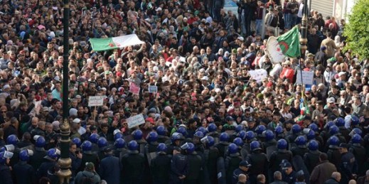 Demonstrators take to the streets to protest against the government and reject the upcoming presidential elections, in Algiers, Algeria, Dec. 11, 2019 (AP photo by Toufik Doudou).