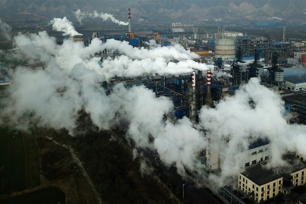 Smoke and steam rise from a coal processing plant in Hejin in central China’s Shanxi Province, Nov. 28, 2019 (AP photo by Sam McNeil).