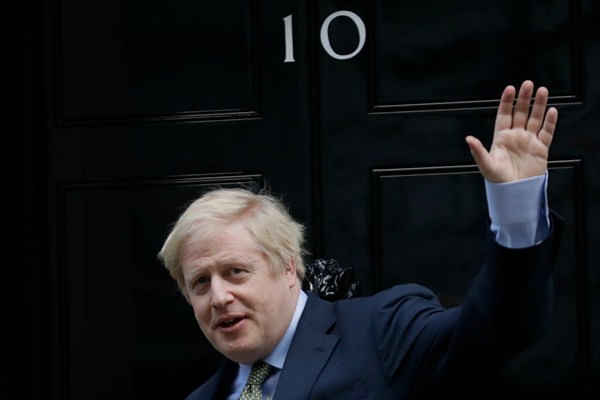 British Prime Minister Boris Johnson returns to 10 Downing Street after meeting with Queen Elizabeth II at Buckingham Palace, London, Dec. 13, 2019 (AP photo by Matt Dunham).