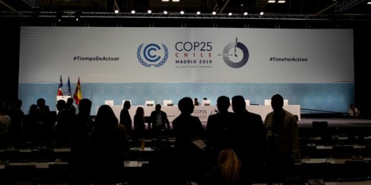 COP25 party members talk ahead of the closing plenary in Madrid, Dec. 15, 2019 (AP photo by Bernat Armangue).