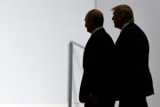 U.S. President Donald Trump and Russian President Vladimir Putin walk to participate in a group photo at the G-20 summit in Osaka, Japan, June 28, 2019 (AP photo by Susan Walsh).
