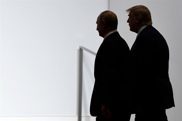 U.S. President Donald Trump and Russian President Vladimir Putin walk to participate in a group photo at the G-20 summit in Osaka, Japan, June 28, 2019 (AP photo by Susan Walsh).