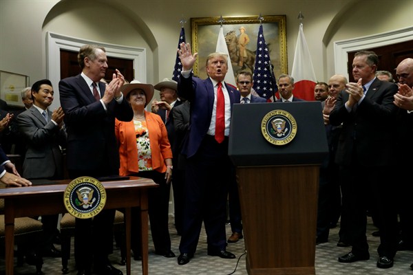 President Donald Trump at a signing ceremony for a trade agreement with Japan in the Roosevelt Room of the White House, Washington, Oct. 7, 2019 (AP photo by Evan Vucci).