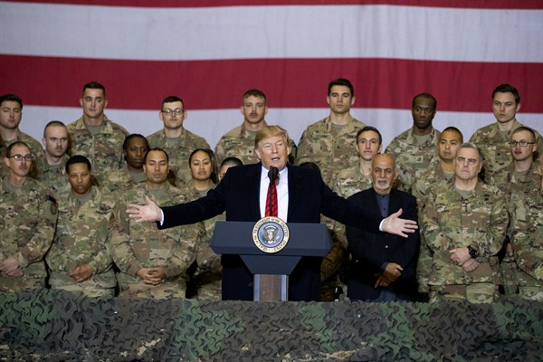 President Donald Trump addresses members of the military during a surprise Thanksgiving Day visit to Afghanistan, Bagram Air Field, Nov. 28, 2019 (AP photo by Alex Brandon).