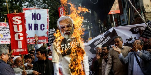 Demonstrators burn an effigy of Indian Prime Minister Narendra Modi.