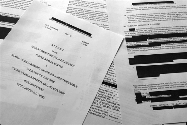 Pages from the Senate Intelligence Committee report that details Russian interference in the 2016 U.S. election, photographed in Washington, July 26, 2019 (AP photo by Jon Elswick).